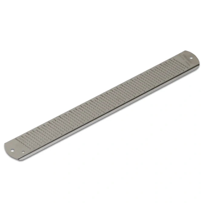 Metal zester on a white background