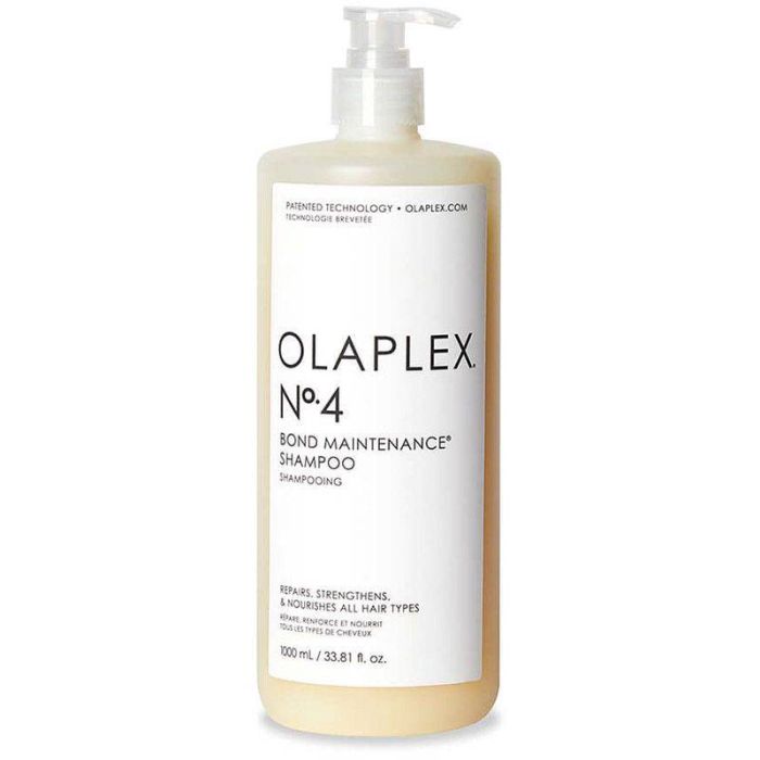 Olaplex No.4 Bond Maintenance Shampoo 1L bottle with clear label and black pump dispenser for hair repair and cleansing.