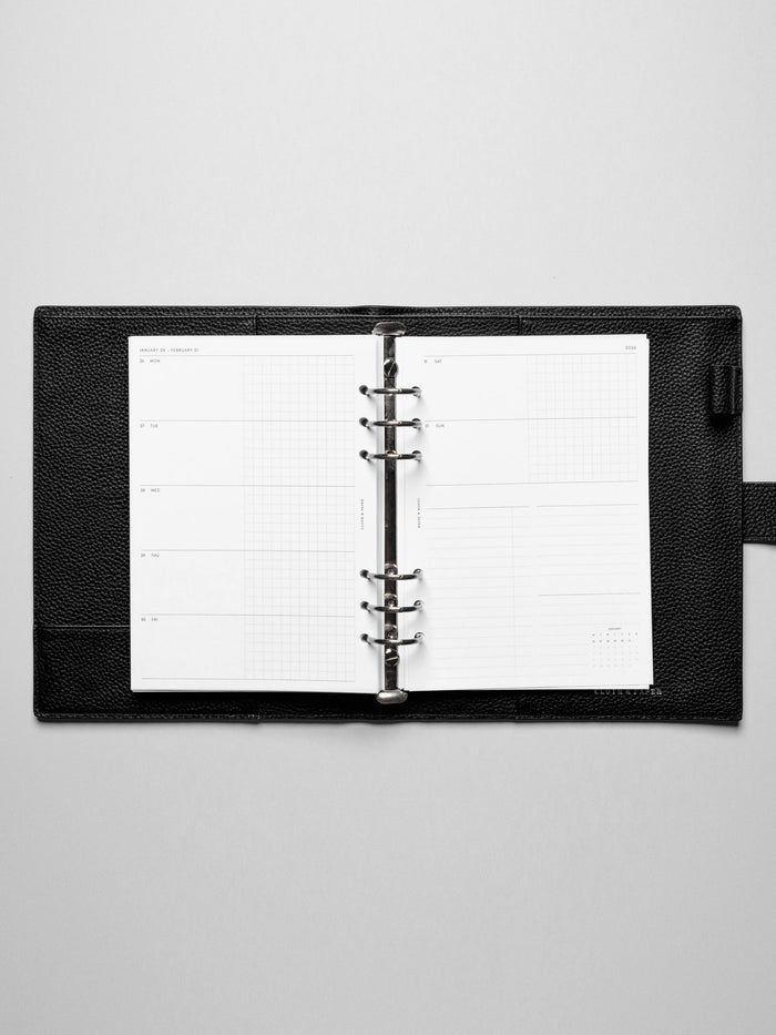 Inserts in use inside a leather planner.