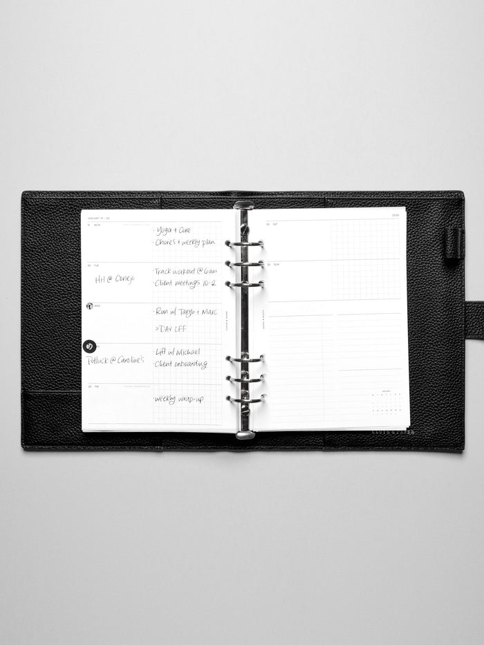 Inserts in use inside a leather planner.