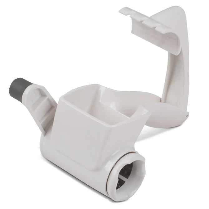 White plastic food grater with a cylindrical nozzle on a white background