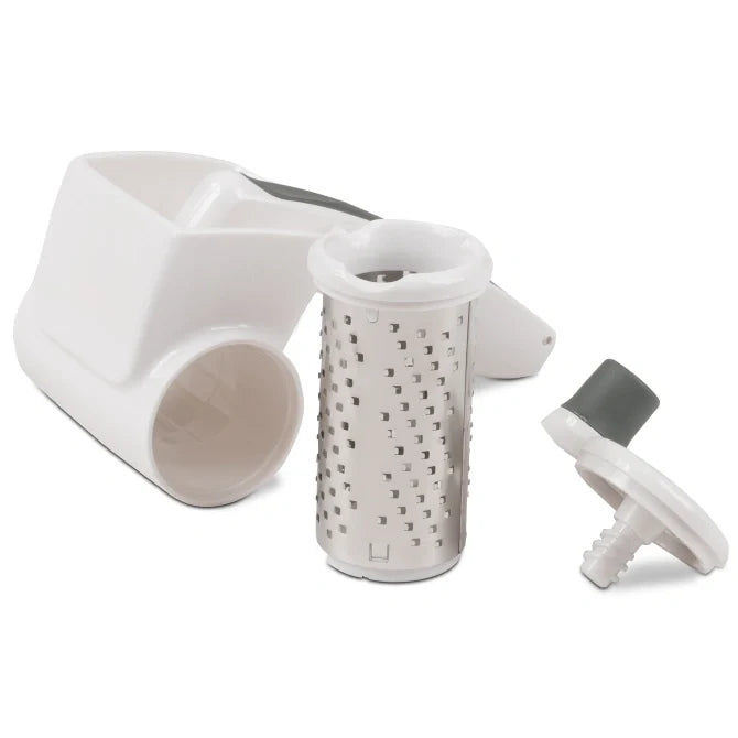 White kitchen food grater with cylindrical component and handle on a white background