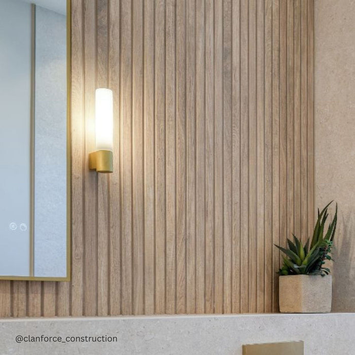 Textured wood effect tiles, bathroom wall light and succulent plant in corner.