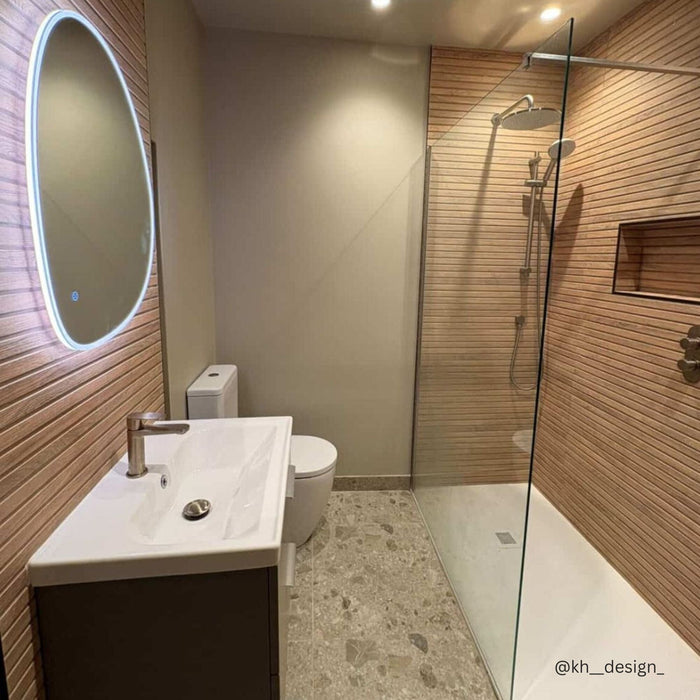 Modern bathroom with ridged wood effect wall tiles and terrazzo effect floor tiles.