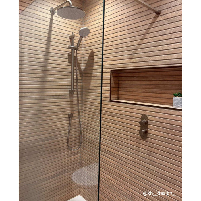 Shower with ridged wood effect wall tiles and a recess shelf