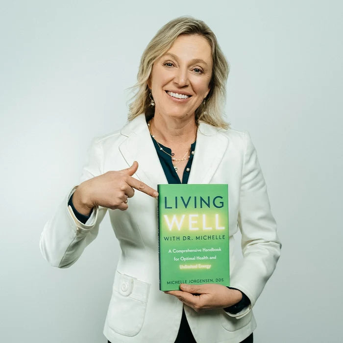 Dr. Michelle Jorgensen holding the Living Well book