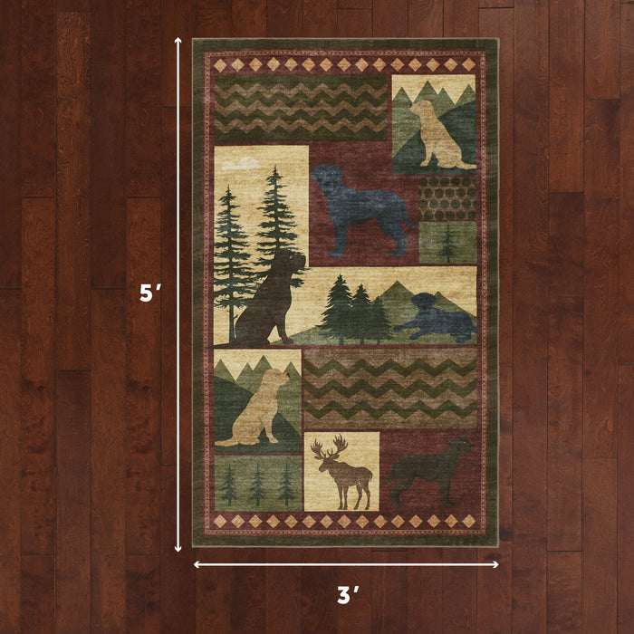 Patchwork rug with wildlife silhouettes including bear, moose, and dogs among forest and geometric patterns in green, cream,
