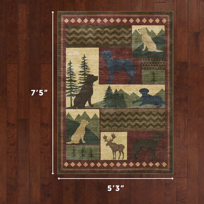 Patchwork rug with wildlife silhouettes including bear, moose, and wolf among geometric patterns and forest motifs in green,