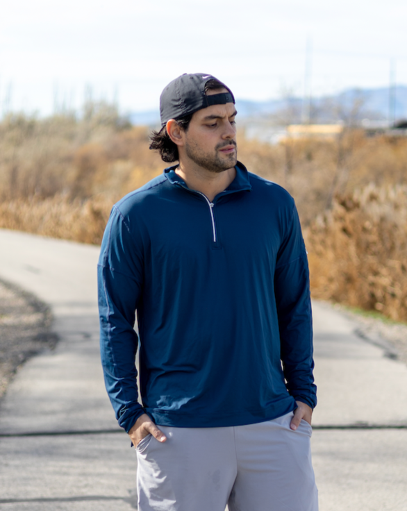 Man walking outside wearing long sleeve mock zip shirt in navy blue (Style 12001) - BloqUV