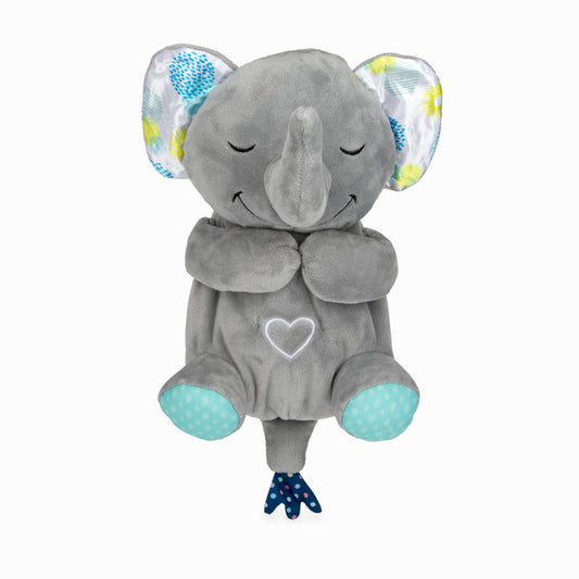 The Motion & Sound Plush is a gray elephant toy with patterned ears, blue polka-dotted feet, and a white heart on its belly, sitting upright with its arms crossed.