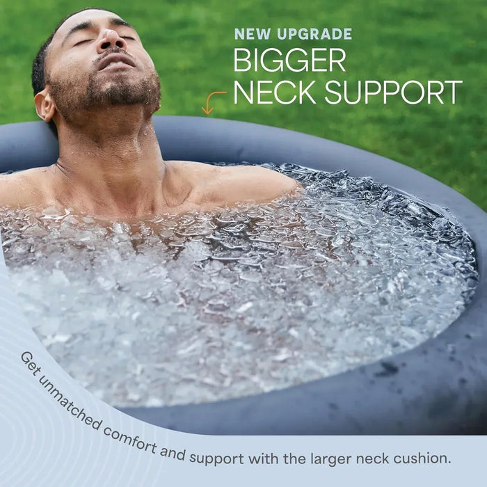 Man reclining in the NordPod ice bath with his head resting on the tub's inflatable neck cushion, captioned 'Bigger Neck Support.'