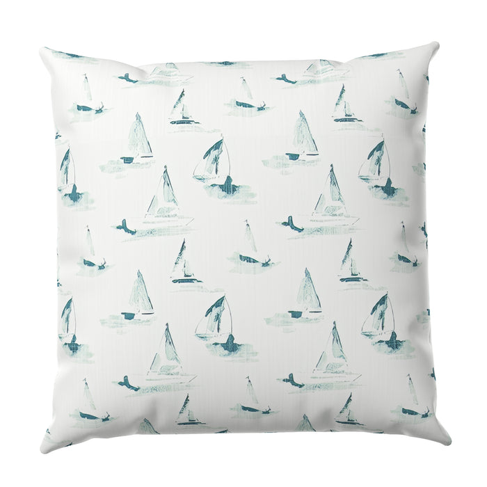 Pillow with sailboat pattern on a white background