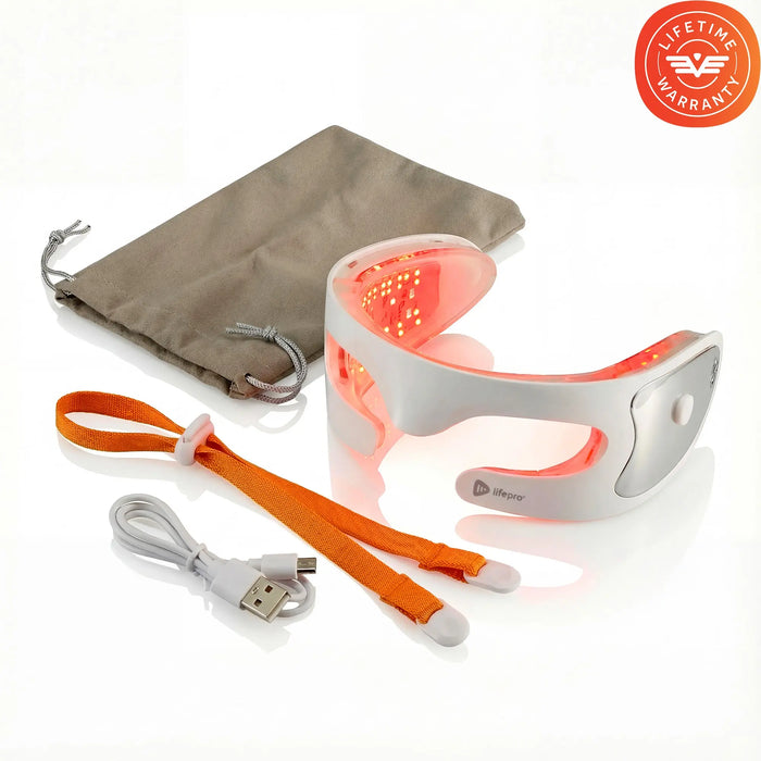 RejuvaGlow eye mask glowing red laid out with its travel pouch, adjustable orange head strap, and USB charging cable.