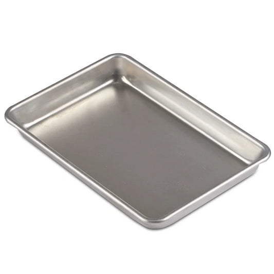 Stainless steel baking tray on a white background