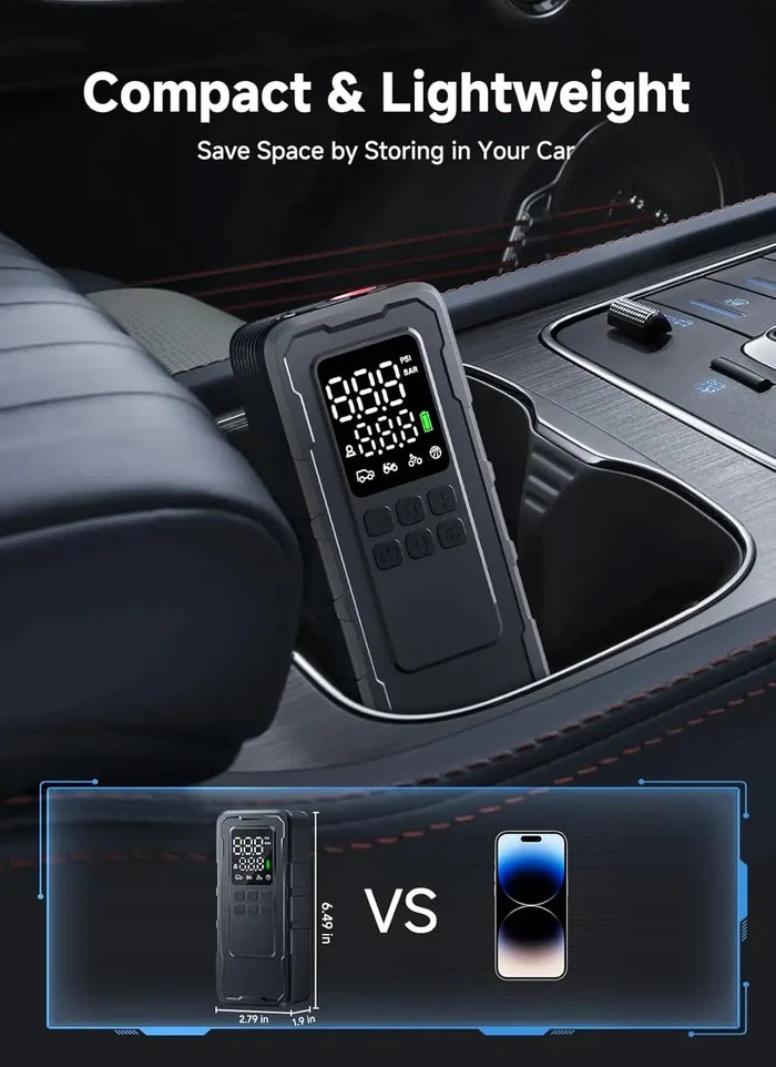 Compact cordless tire inflator stored in car cupholder next to phone for size comparison