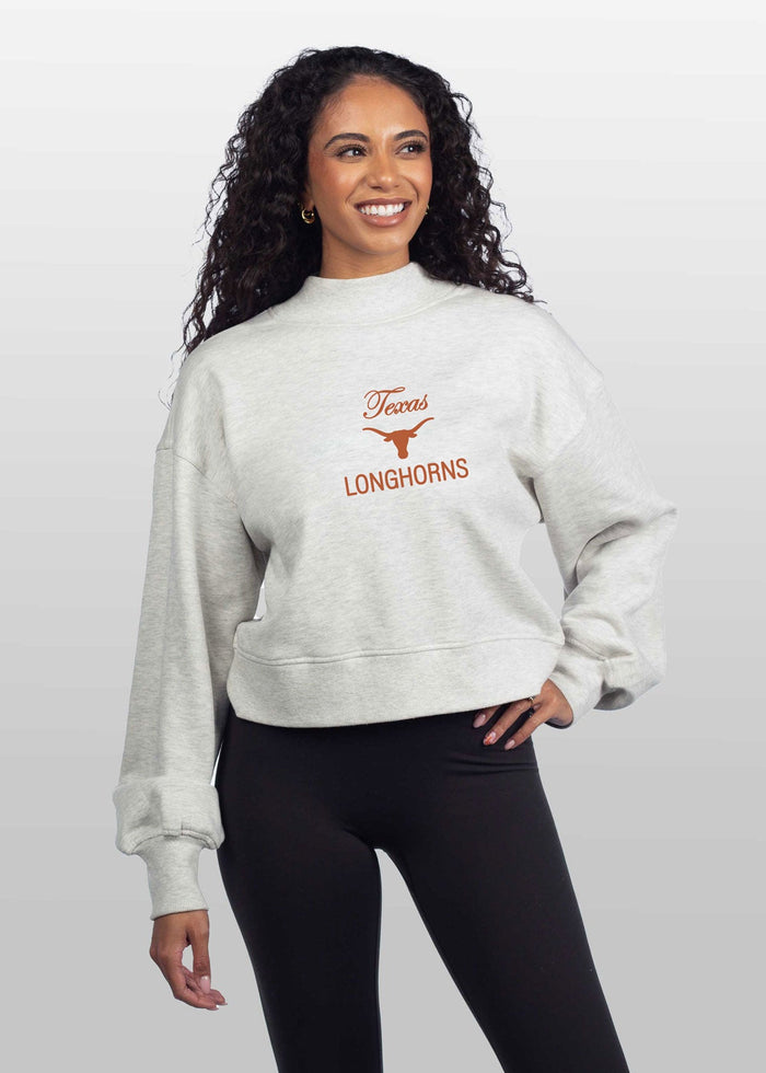 Texas Longhorns Women's Ash-Grey Relaxed, waist-length Heavyweight Fleece Sweatshirt with mock neck, drop shoulders and balloon sleeves