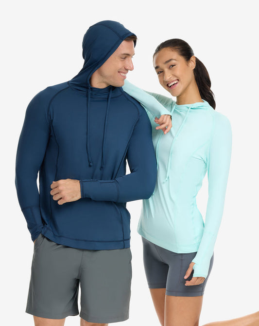 Two people wearing athletic clothing on a white background