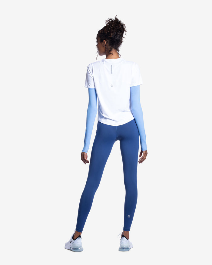 Women wearing indigo color unisex sleeves with short sleeve white crew. Back of shirt and sleevesshown. (Style 5005) - BloqUV