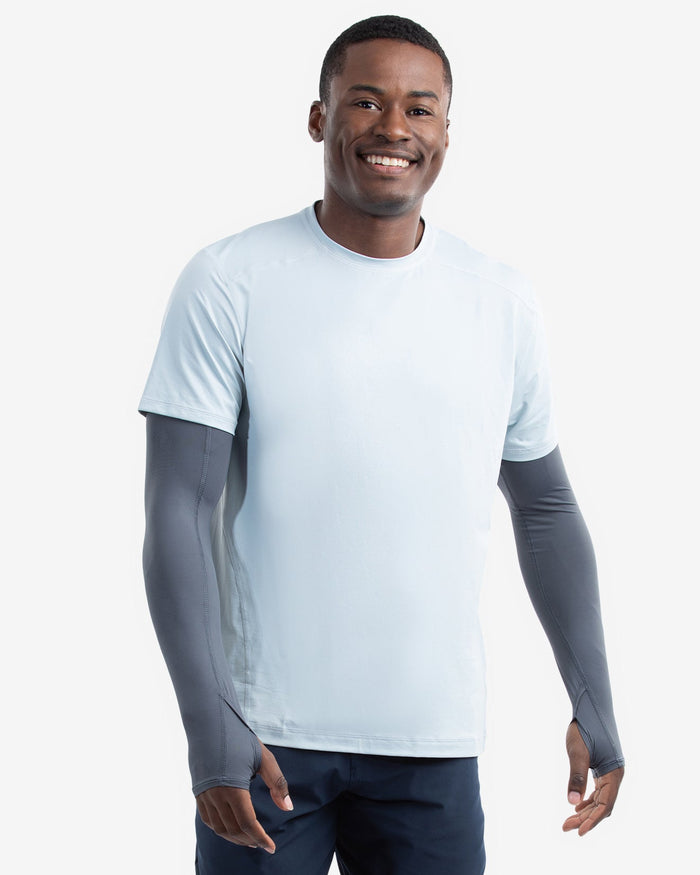 Man wearing a light blue t-shirt with gray sleeves on a white background