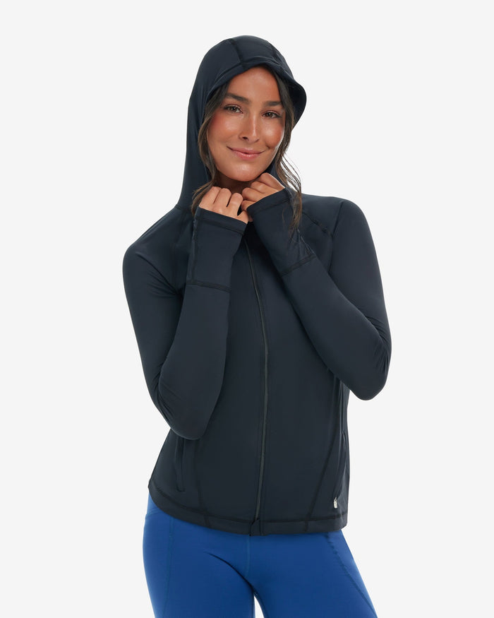Woman wearing a black hoodie jacket on a white background