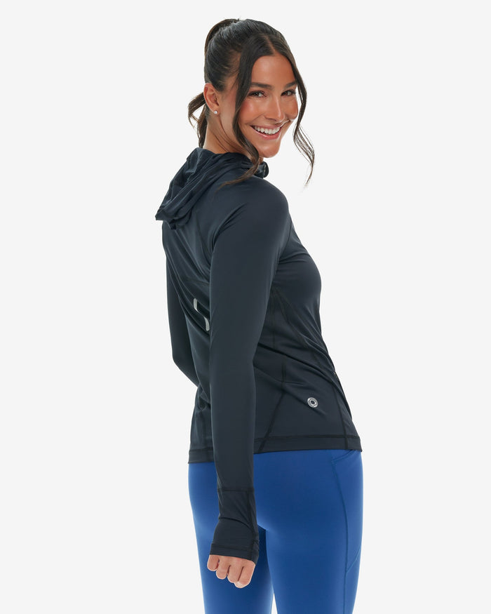 Woman wearing a black hoodie jacket on a white background
