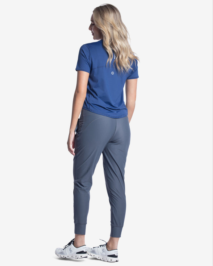 A pair of blue women's joggers with a high waist and front pockets.