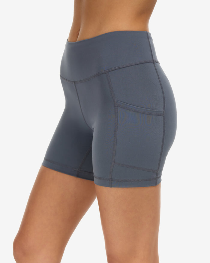 Women wearing training shorts in smoke showing the side pocket. (Style 6200) - BloqUV