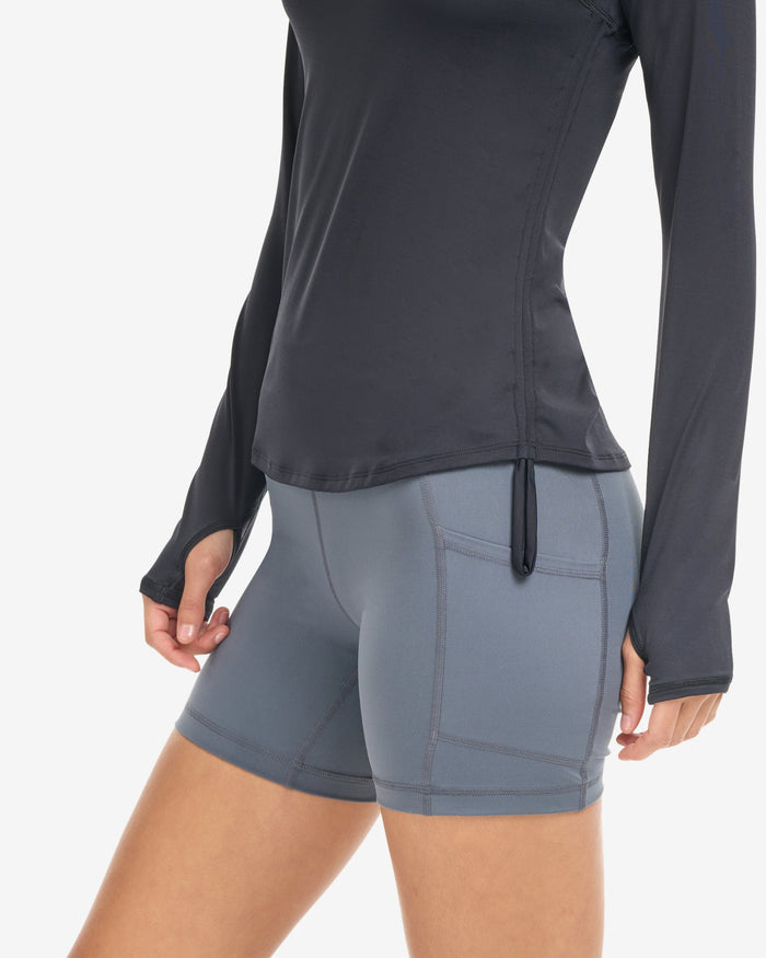 Women wearing training shorts in smoke showing the side pocket. (Style 6200) - BloqUV