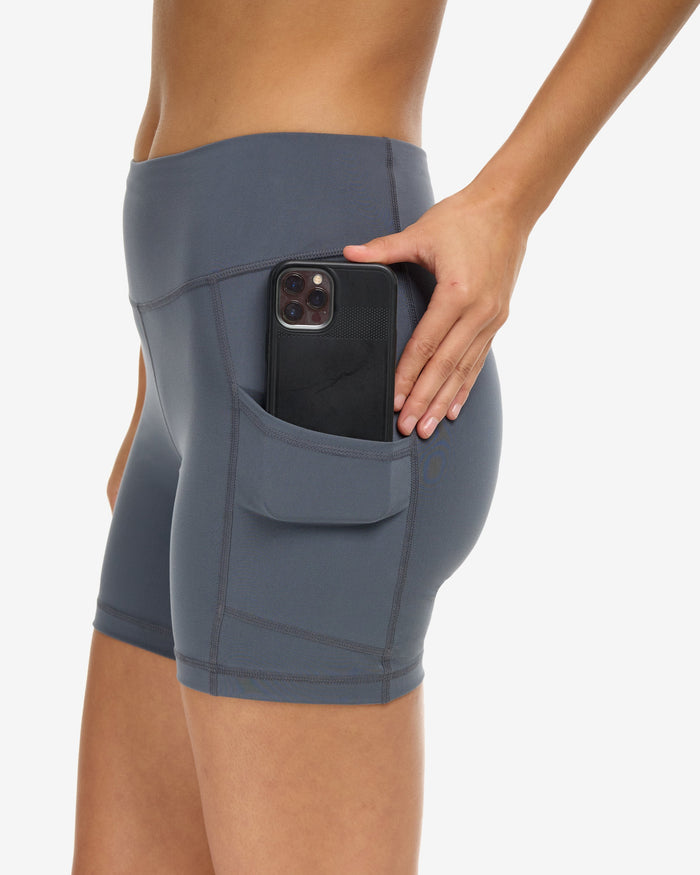 Women wearing training shorts in smoke showing cell phone inside the side pocket. (Style 6200) - BloqUV