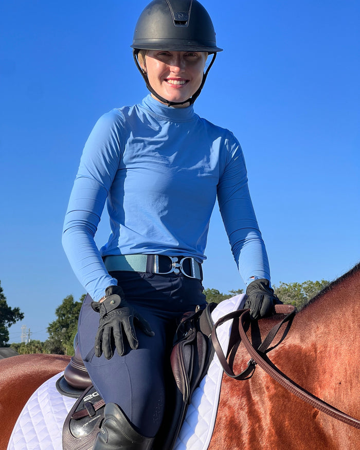 Women wearing indigo turtle neck top on a horse. (Style 2013) - BloqUV