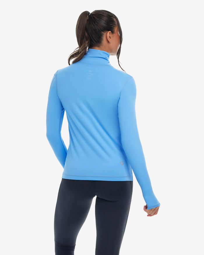 Women wearing indigo turtle neck top with black tights. (Style 2013) - BloqUV